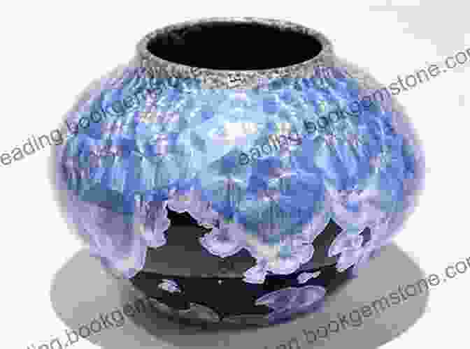 A Ceramic Bowl With A Vibrant Blue Glaze And Intricate Gold Detailing. Colour In Glazes (New Ceramics)