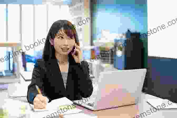 A Japanese Office Worker Sitting At A Desk In A Modern Office Building With Respect To The Japanese: Going To Work In Japan