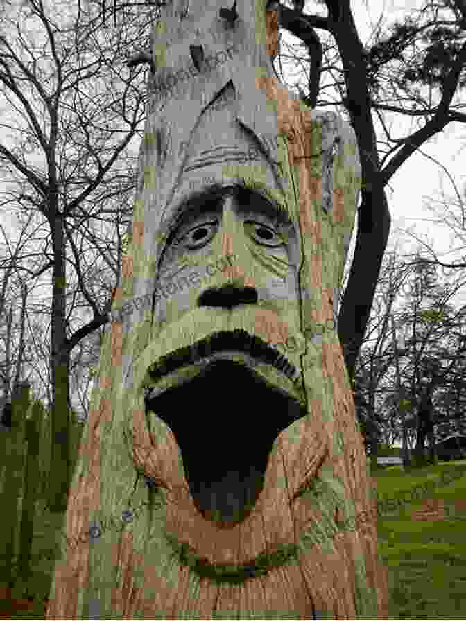 A Majestic Tree With A Face Carved Into Its Bark, Representing A Tree Folk The Tree Folk
