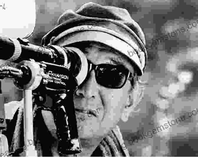 Akira Kurosawa Holding A Camera, With A Determined Expression On His Face Something Like An Autobiography Akira Kurosawa